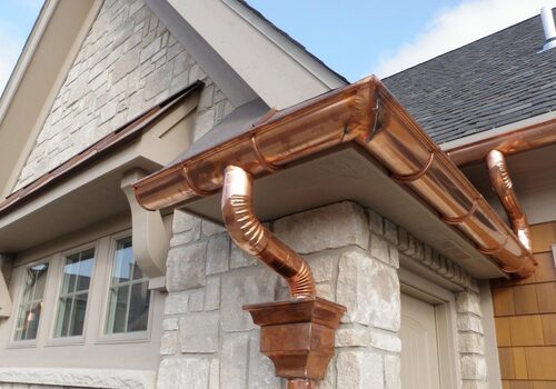 homeguide-up-close-view-of-sectional-copper-gutters-installation